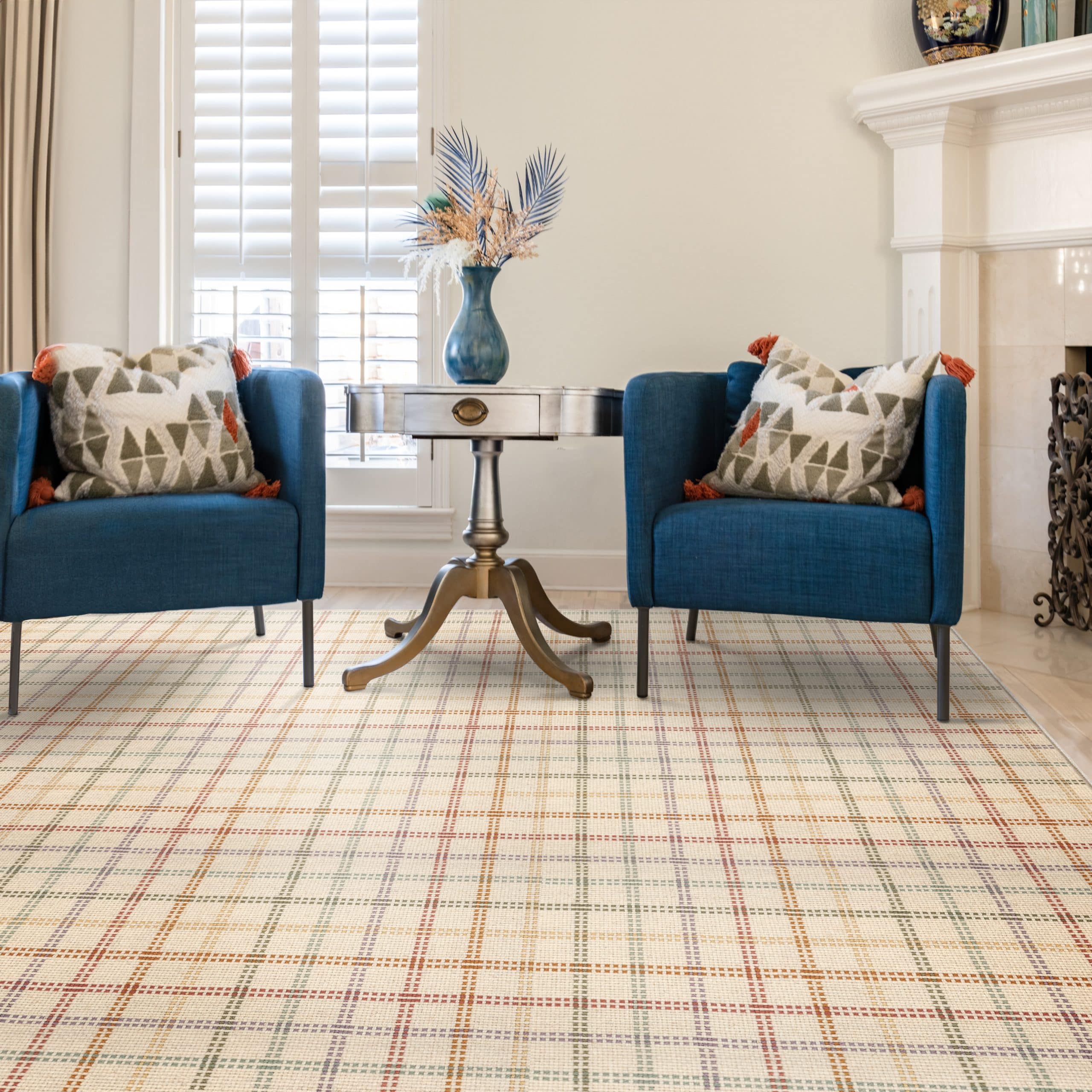 Blue chairs with table, carpeting done by Owens Custom Rugs